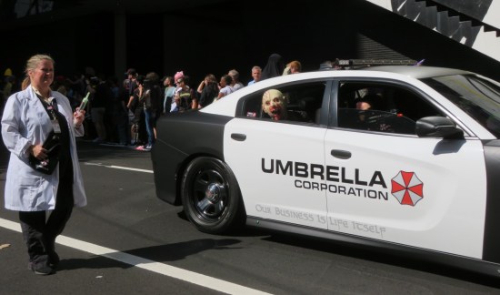 Umbrella Corporation police car with zombie head sticking out the back door.