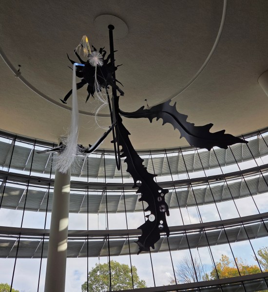 Black Dandelion art installation, spiraling toward the high ceiling.