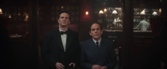 Andrew Scott in a tuxedo, one foot taller than Ethan Hawke in a 1940s suit. Both stand in a bar, staring through us at an offscreen woman.