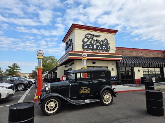 Ford's Garage restaurant with black antique auto parked out front.