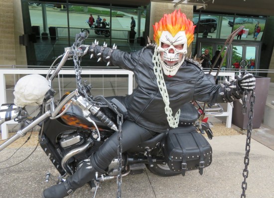 Ghost Rider cosplayer on a motorcycle tricked out exactly like from the comics.