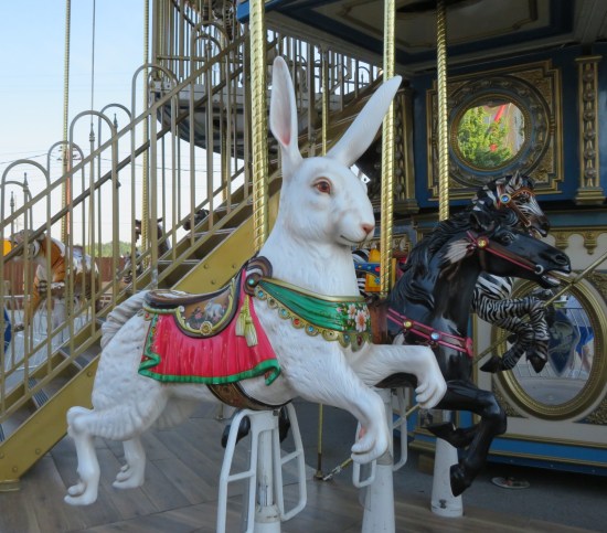 White carousel horse with a rabbit's head.