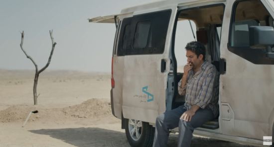 An Iranian auto mechanic sits in his van in the middle of the desert, smoking and thinking. Not far away are a body-sized hole he's dug and a discarded shovel.