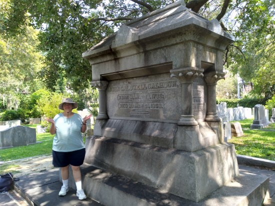 Anne kinda shrugging next to the crypt of John C. Calhoun, which is about ten feet tall and has his name and dates on the side.