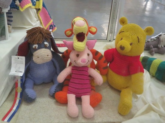 knitted dolls of Pooh, Eeyore, Tigger and Piglet.