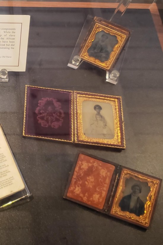 Three small 19th-century frames with photos of Black women.