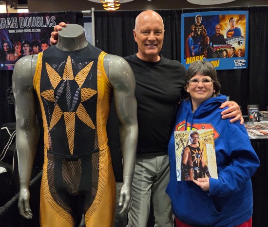 Anne posing with Mark Pillow and one of his old Nuclear Man costumes.