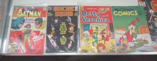 four comics in glass case per caption