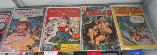 four old comics in glass case per caption