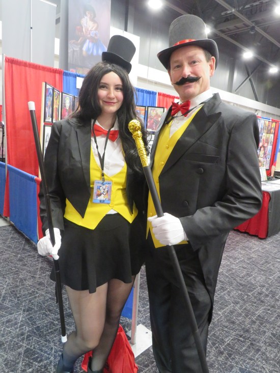 Zatanna and Zatara cosplayers with magicians' wands.