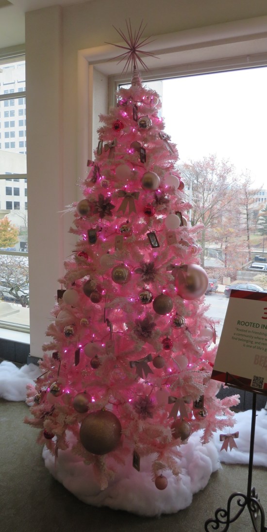 pink Christmas tree with white ornaments.