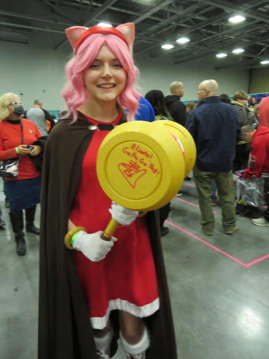 Amy Rose costume with giant yellow hammer autographed on the end by Ben Schwartz.