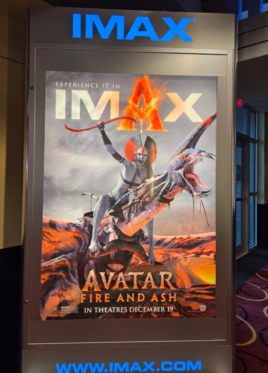 Avatar 3 IMAX poster with Oona Chaplin's evil fire-motif warrior astride her pet alien dragon.