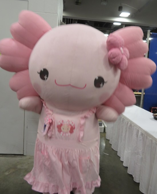 Giant pink axolotl fuzzy mascot costume.
