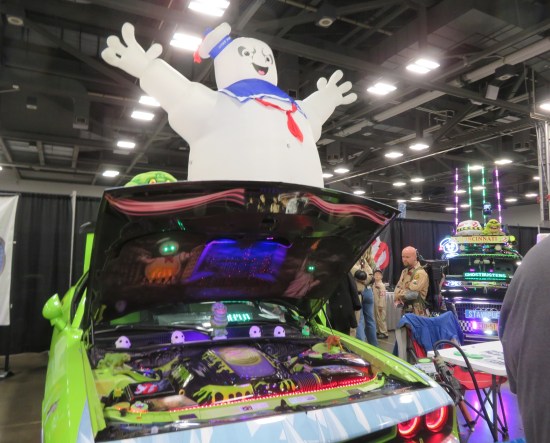 Ghostbusters car engine, inflatable giant Sta-Puft Man, and cosplayers.