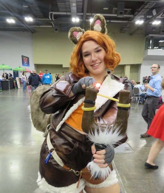 Squirrel Girl cosplayer with slingshot.