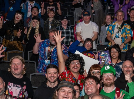 Us doing jazz hands in a crowd, but an excited Weird Al cosplayer is blocking me.