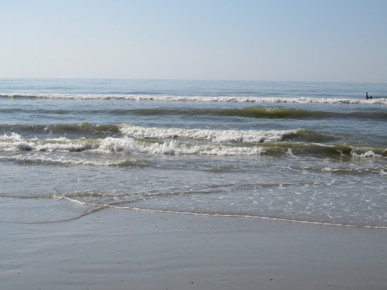 tiny waves along a deserted beach