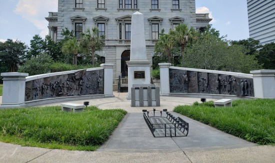 monument made of two separate walls, each with friezes observing Black history.