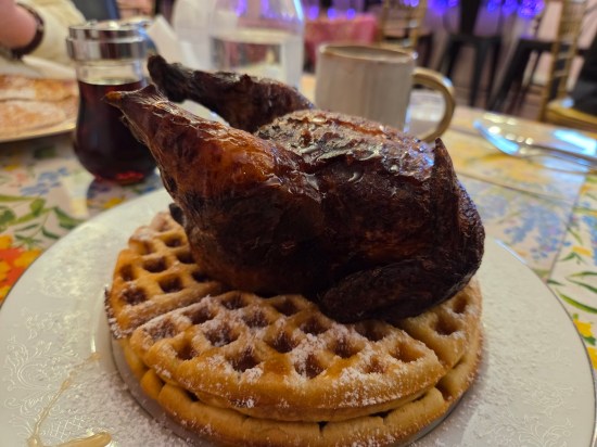 Nicely fried Cornish hen atop two waffles.