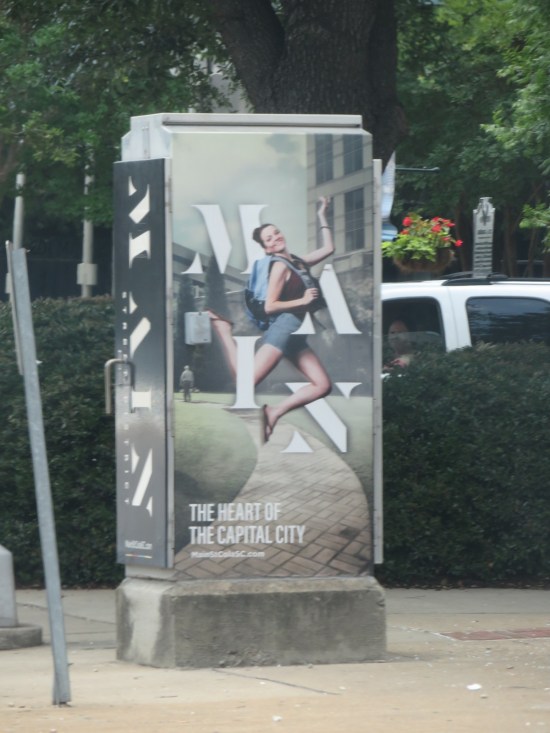 Lightbox with photo of happy dancing woman above headline for "Heart of the Capital City".