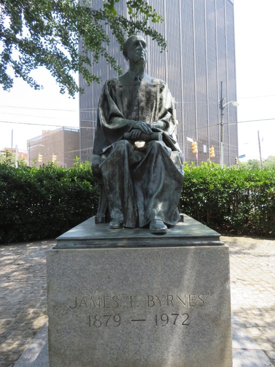 James F. Byrnes statue, sitting on a pedestal in a judge's robe.