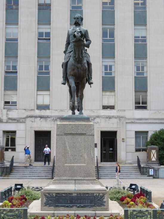 General Wade Hampton statue, on horseback and armed on a high pedestal.