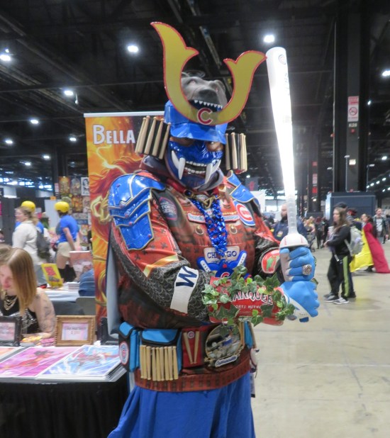 cosplay: sword-wielding blue samurai adorned with Chicago Cubs emblems and lots of tiny baseball bats.