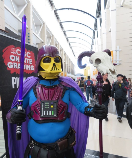 purple and yellow cosplay mash-up of Darth Vader and Skeletor from Masters of the Universe.