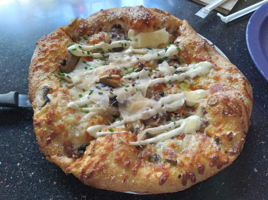 Mushroom pizza with three kinds of mushrooms.