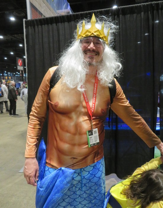 father and daughter costumed as King Triton and Flounder from "The Little Mermaid".