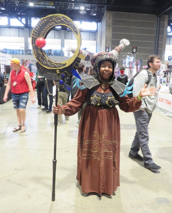 cosplay: Rita Repulsa with staff in one hand and jazz in the other.