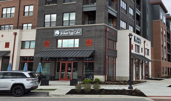 Another Broken Egg Plainfield corner storefront. One side is black brick with white mortar, the other all white bricks.