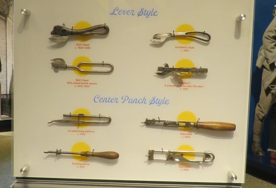 Eight different old can openers on display.