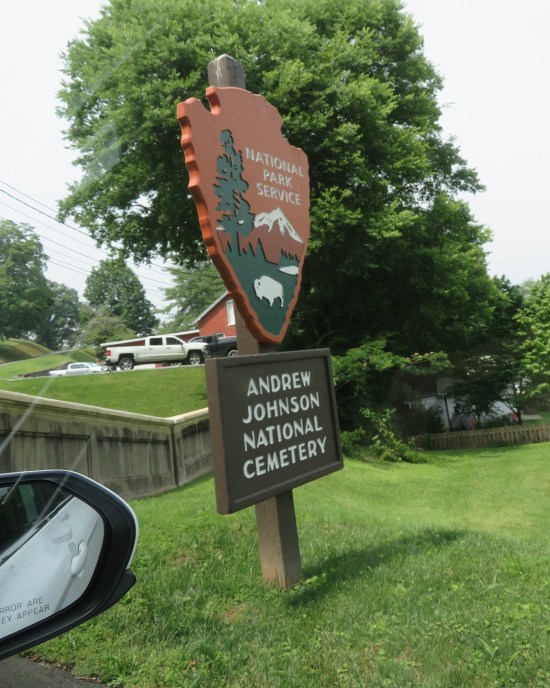 National Parks Service entrance sign to Andrew Johnson National Cemetery. Behind it is an ordinary residential neighborhood.