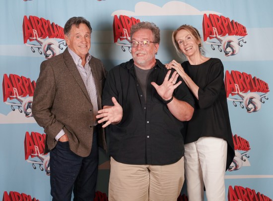 Airplane logo backdrop behind Robert Hays, Julie Hagerty, and just me doing jazz hands.