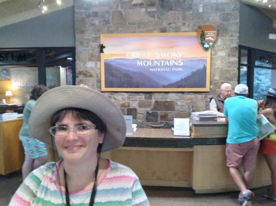 Anne standing in front of visitor center front desk.