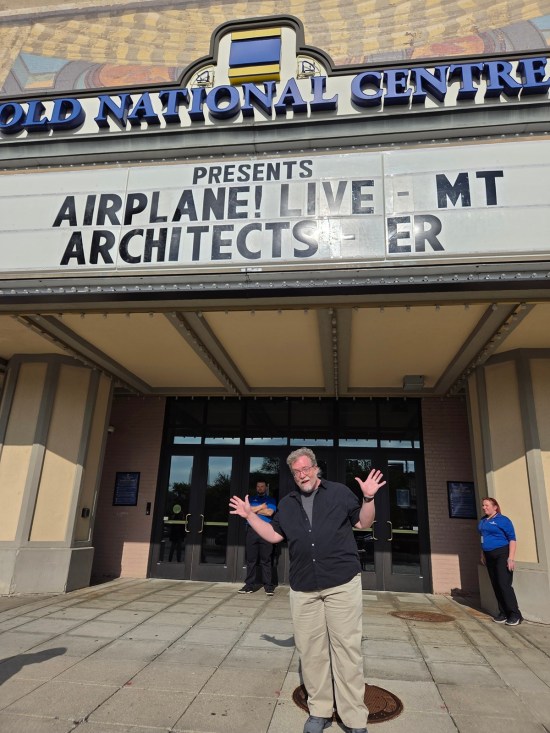 Me doing jazz hands under the Murat's marquee announcing "Airplane! Live" and Architects in concert.
