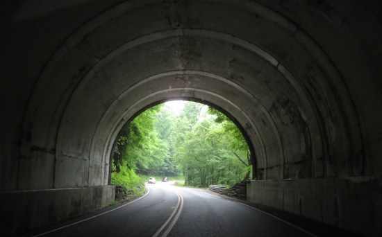 park road tunneled under a mountain, rather dark inside
