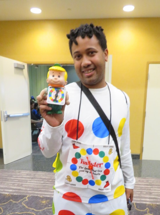 Twister costume; cosplayer holds up an Elroy Jetson doll with tiny Twister spinner.