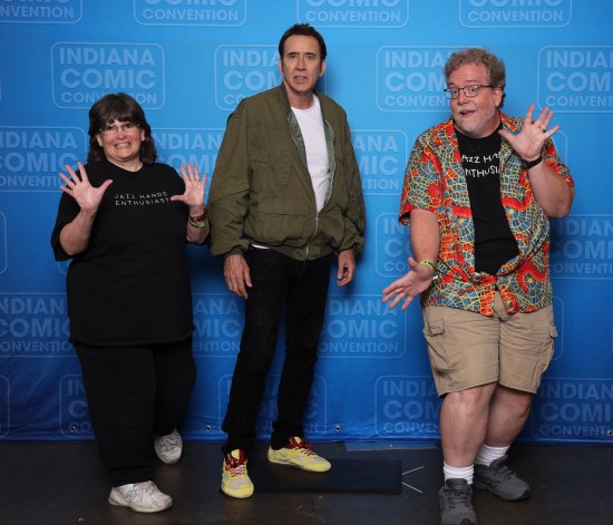 Us doing jazz hands with Nicolas Cage, who seems a bit too stricken by something to smile.