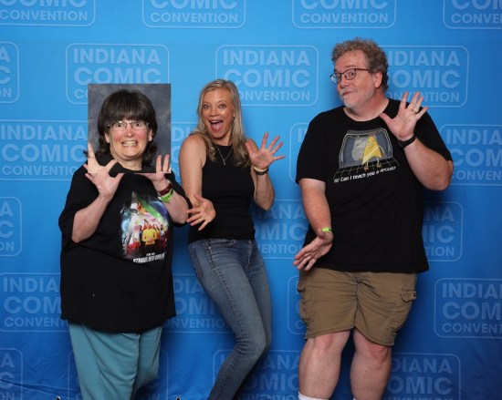 Same photo as the last one except Anne's head is replaced by a mismatched one from another pic, with a gray background instead of a matching blue one.