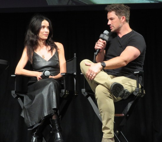 Abigail Spencer and Matt Lanter sitting on stage, clearer shot.