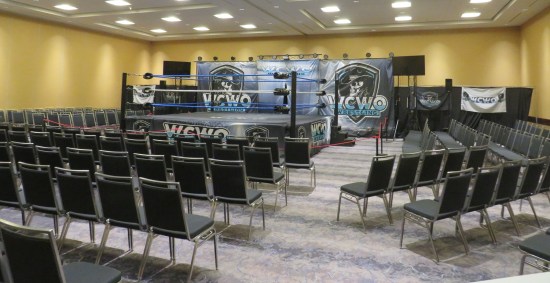 WCWO wrestling ring surrounded by audience chairs, all empty.