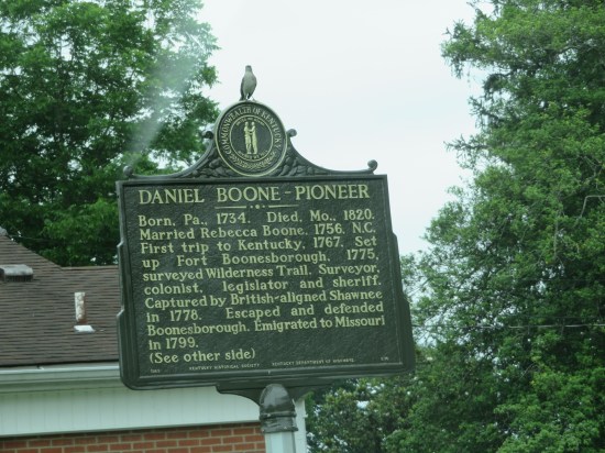 historical marker titled "Daniel Boone Pioneer" mentions wife Rebecca, job titles and that time the Shawnee worked with the Redcoats and captured him.