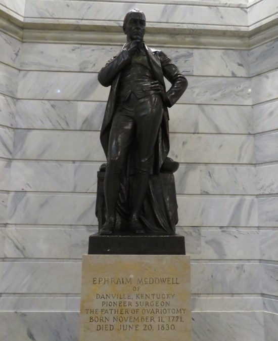 Ephraim McDowell statue, hand on chin, pondering.