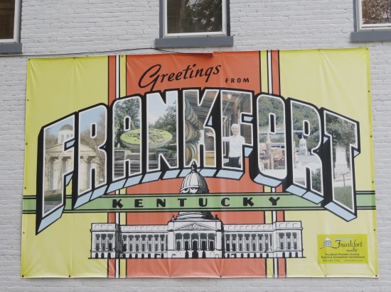 Greetings From Frankfort banner strung up on building.