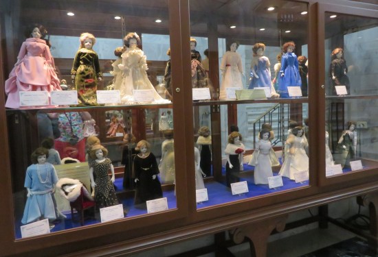 Fancy display cases holding a few dozen fancy dolls in period dresses.