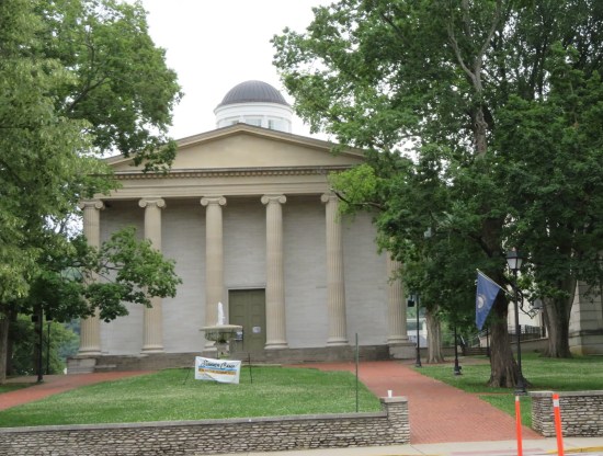 Old State Capitol, Greek architecture, with greenery on a main street.