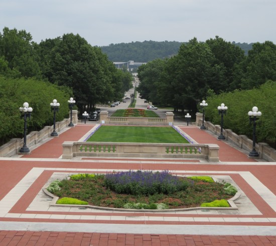 Kentucky State Capitol plaza with square grass plots surrounded by brick sidewalks and white globe streetlights
